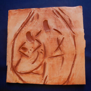 A 19-year-old woman from Burma sculpted this tile to show that her idea of a safe place is within the family. (courtesy photo)