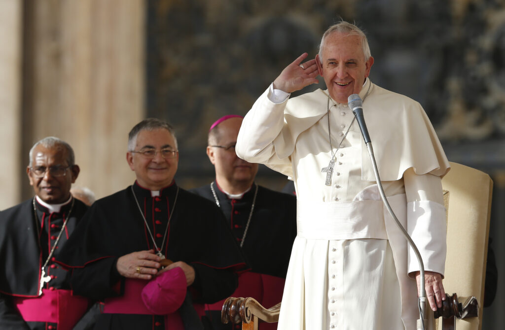 Pope Francis gestures towards the crowd as he begins his general audience in St. Peter's Square at the Vatican Nov. 5. The pope announced that he will visit the Shroud of Turin June 21, 2015. The shroud will be on public display April 19-June 24, 2015. (CNS photo/Paul Haring)