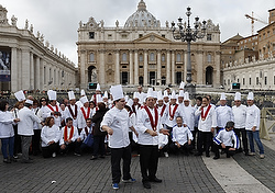 Cooks from the southern Italian region of Basilicata prepare to pose for a group photo after attending Pope Francis' general audience in St. Peter's Square at the Vatican Nov. 5. (CNS photo/Paul Haring)