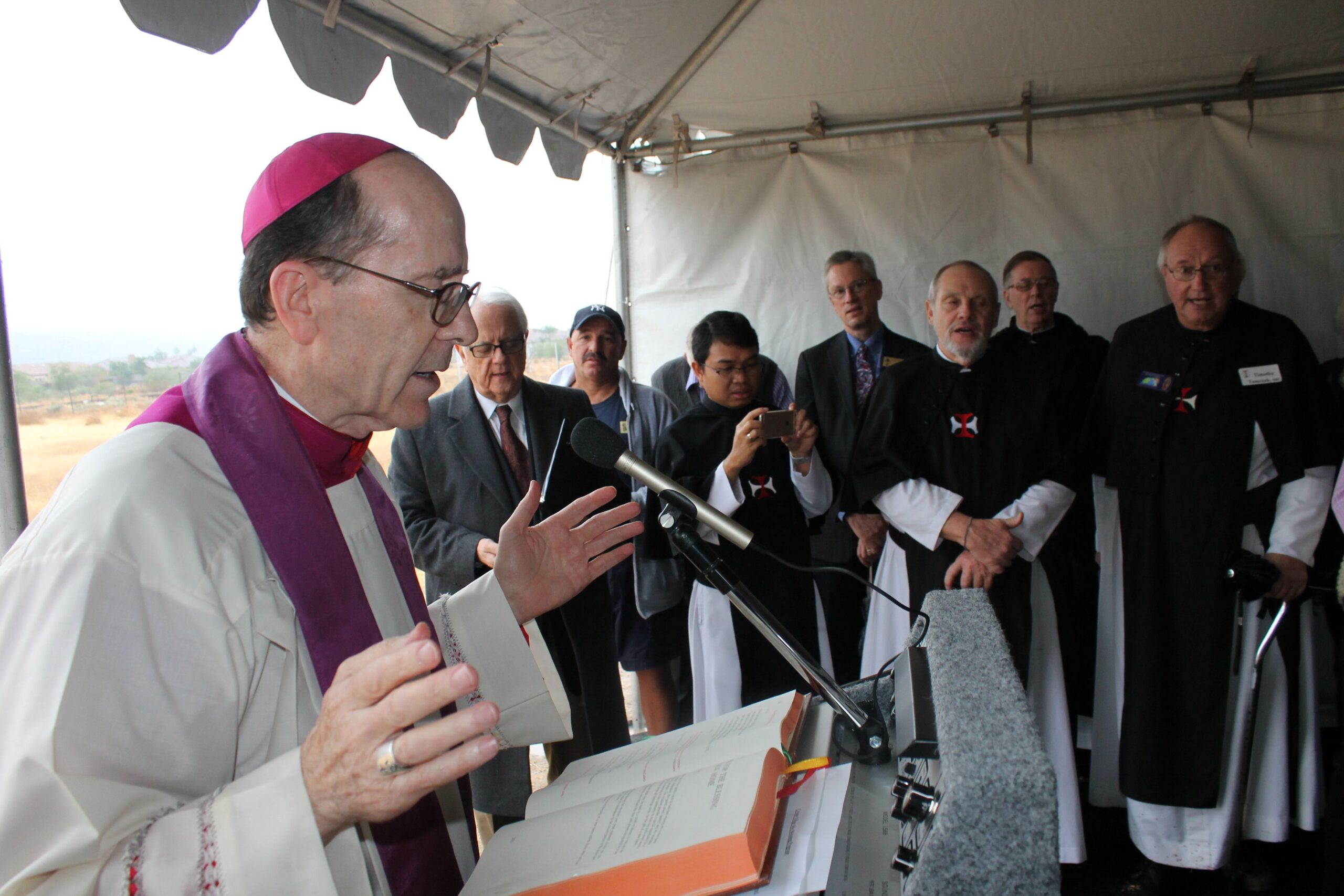 Bishop Thomas J. Olmsted blessed the land at the base of South Mountain where the Crosier Fathers and Brothers will build the Crosier Village. (Joyce Coronel/Catholic Sun)