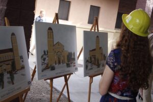 A young St. Bernadette parishioner examines renderings of the community's first permanent worship space Dec. 7. (Ambria Hammel/CATHOLIC SUN)