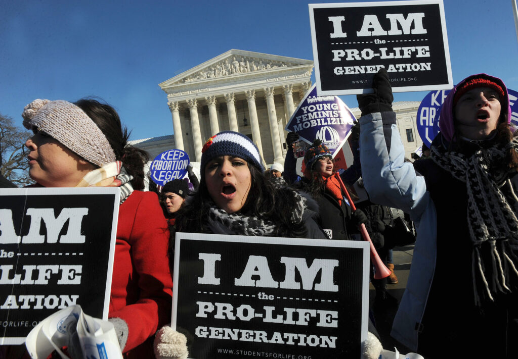 March for Life participants from Benedictine College in Atchison, Kan., carry the banner past the front of the U.S. Supreme Court building in Washington Jan. 22, 2014. Thousands took part in the annual event, which last year marked the 41st anniversary of the Supreme Court Roe v. Wade decision that legalized abortion across the nation. 
