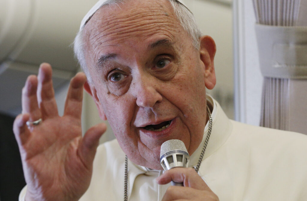 Pope Francis responds to questions about the September U.S. papal visit during a news conference aboard his flight from Manila, Philippines, to Rome Jan. 19. (CNS photo/Paul Haring)