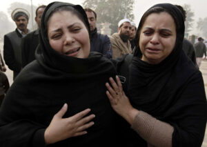 Pakistani women weep during a memorial ceremony Dec. 23, 2014, outside an army-run school in Peshawar, Pakistan, that was attacked by militants. (CNS photo/Ashad Arbab, EPA)