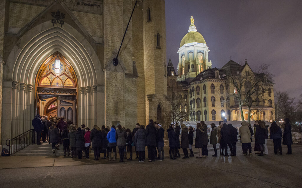 Students wait in line March 3 outside the Basilica of the Sacred Heart on the campus of the University of Notre Dame to pay their respects at a visitation for Holy Cross Father Theodore Hesburgh, former Notre Dame president. Father Hesburgh died Feb. 26 at age 97 in the Holy Cross House adjacent to the university in Indiana. (CNS photo/Barbara Johnston, University of Notre Dame)