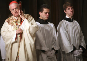 Cardinal Edward M. Egan holds his crosier as he celebrates his final Easter Mass as head of the Archdiocese of New York at St. Patrick's Cathedral in this 209 file photo. Pope Benedict XVI named Milwaukee Archbishop Timothy M. Dolan to succeed Cardinal Egan as head of the nation's second largest archdiocese. (CNS photo/Patrick Andrade, Reuters)