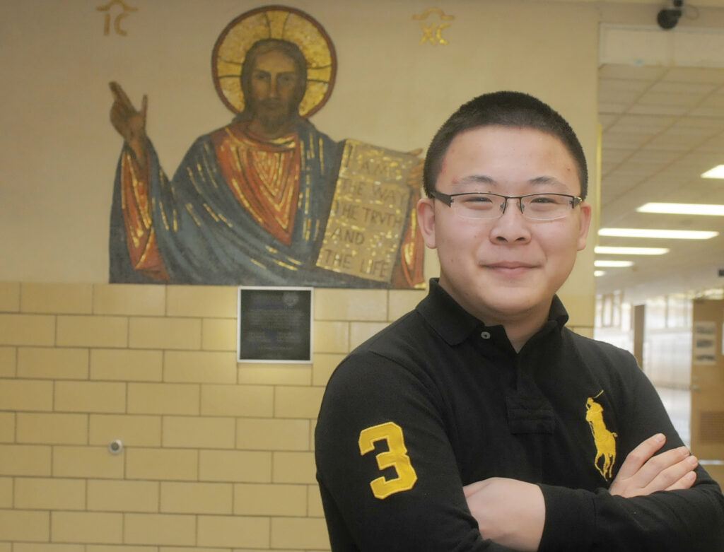 Peter Yang, 18, a senior at Cathedral High School in St. Cloud, Minn., who is going through the Rite of Christian Initiation of Adults tobecome a Catholic at the Easter Vigil, poses for a photo Feb. 8. (CNS photo/Dianne Towalski, The Catholic Spirit)