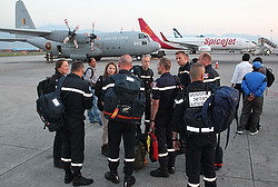 United Nations and other international relief workers stand at Kathmandu airport in Nepal April 27. Inclement weather and logistical pressures have slowed down relief for Nepal earthquake victims.  (CNS photo/Anto Akkara) 