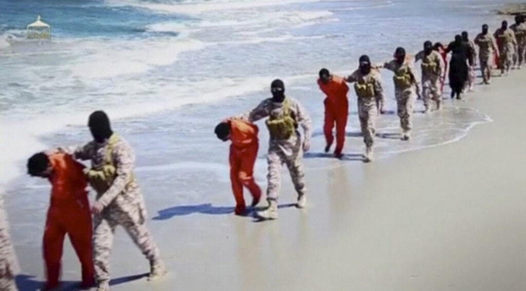 Islamic State militants lead what are said to be Ethiopian Christians along a beach in Libya in this still image from an undated video made available on a social media website April 19. With so many women and men being killed because of their faith in Christ, the church today is a church of martyrs, Pope Francis said in a morning homily. (CNS photo/Social Media Website via Reuters TV)