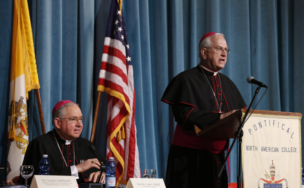 Archbishop Joseph E. Kurtz of Louisville, Ky., president of the U.S. Conference of Catholic Bishops, speaks during during a symposium on Blessed Junipero Serra at the Pontifical North American College in Rome May 2. Also pictured is Archbishop Jose H. Gomez of Los Angeles. The symposium was held before Pope Francis' midday visit to the college to celebrate Mass. (CNS photo/Paul Haring)