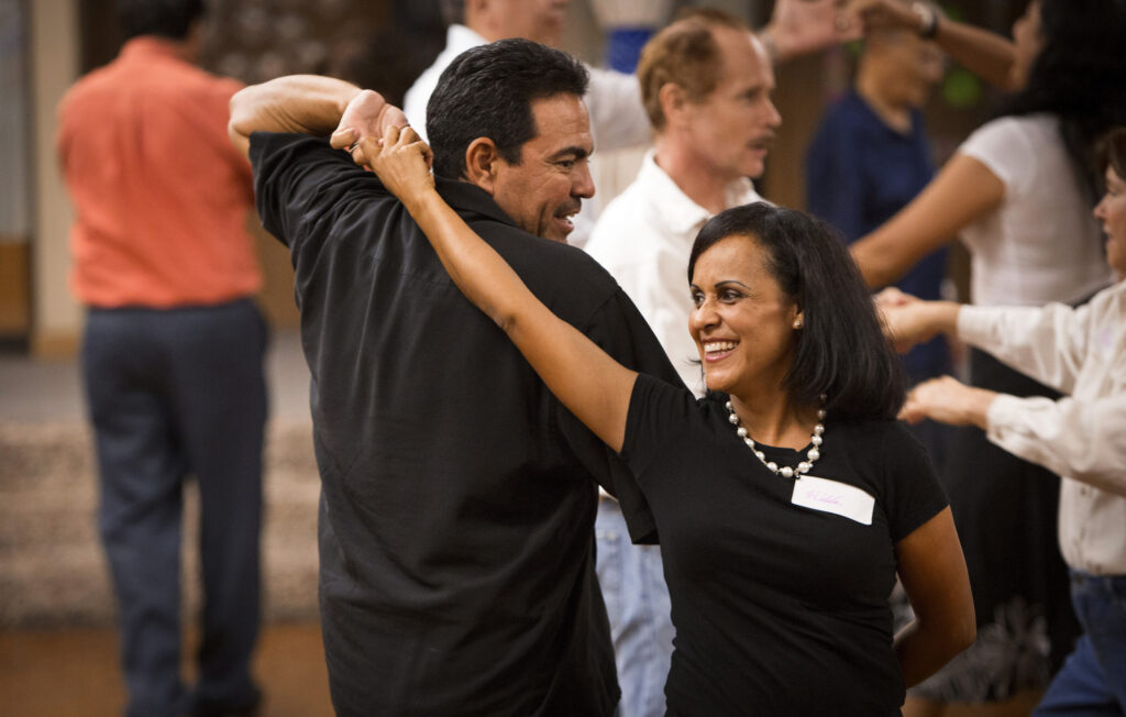 Alex and Hilda Ramirez enjoy a dance lesson as married couples gather for a social at St. Timothy's Church in Mesa, Ariz., Sept. 26, 2014. The parish has several opportunities throughout the year for husbands and wives to get together for spiritual renewal, socials and marital support. (CNS photo/Nancy Wiechec)