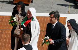 Devotees present a relic of new Saint Mary of Jesus Crucified during the canonization Mass for four new saints celebrated by Pope Francis in St. Peter's Square at the Vatican May 17. The pope canonized four 19th-century nuns. (CNS photo/Paul Haring)