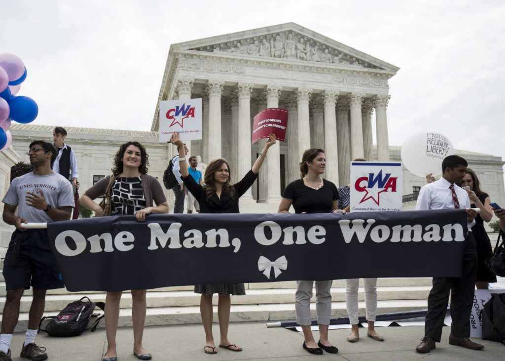 Supporters of traditional marriage between a man and a woman rally in front of the U.S. Supreme Court in Washington June 26, shortly before the justices handed down a 5-4 ruling that states must license same-sex marriages and must recognize same-sex marriages performed in other states. (CNS photo/Joshua Roberts, Reuters) See SCOTUS-MARRIAGE June 26, 2015.