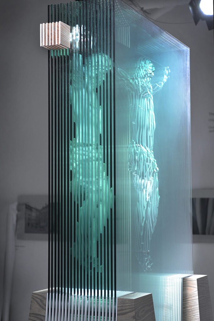 Glass sculpture of Crucifixion produced by artist Jed Malitz is seen in his New Orleans studio. The figure is produced by light shining through 13 meticulously arranged panes of sculpted glass cut using a computer-guided process. (CNS photo/Frank Methe)