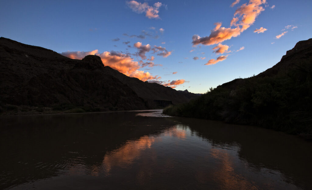 An evening sky is reflected on the Colorado River in Grand Canyon National Park in this September 2014 photo. The river is a critical resource, supplying water to 30 million people and thousands of acres of farmland. Pope Francis' long-anticipated encyclical on the environment was released at the Vatican June 18. (CNS photo/Nancy Wiechec) 