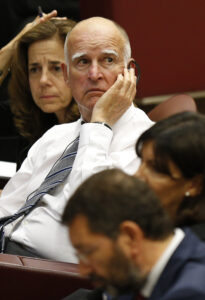 California Gov. Jerry Brown and mayors from around the world attend a workshop on climate change and human trafficking in the synod hall at the Vatican July 21. Local government leaders were invited to the Vatican by the pontifical academies of sciences and social sciences to sign a declaration recognizing that climate change and extreme poverty are influenced by human activity. They also pledged to pursue low impact development of cities. (CNS photo/Paul Haring)