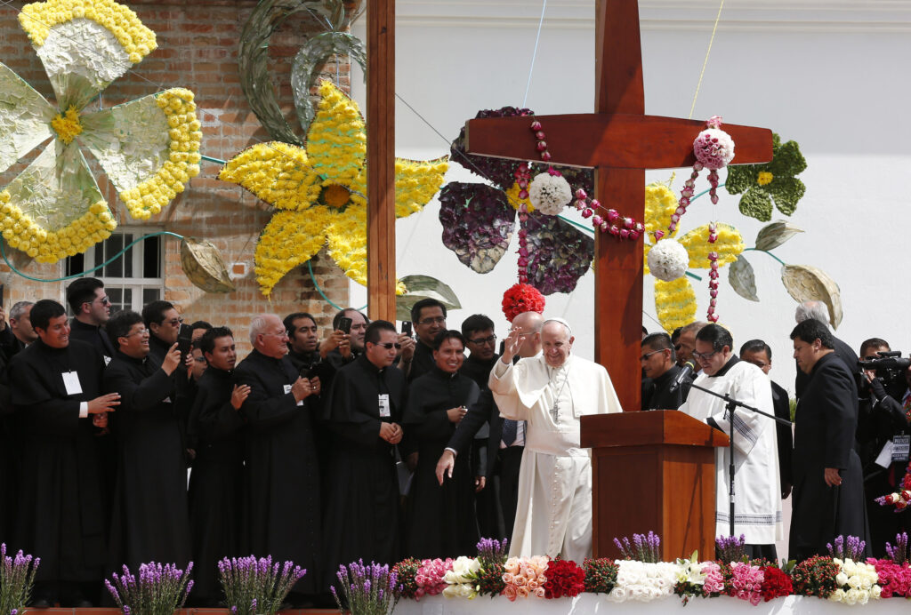 Pope Francis waves during a meeting with clergy, religious men and women, and seminarians at the El Quinche National Marian Shrine in Quito, Ecuador, July 8. (CNS photo/Paul Haring)