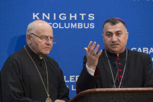Chaldean Catholic Archbishop Bashar Warda of Irbil, Iraq, gestures alongside Melkite Archbishop Jean-Clement Jeanbart of Aleppo, Syria, during an Aug. 4 news conference at the Knights of Columbus 133rd Supreme Convention in Philadelphia. (CNS photo/Matthew Barrick, Knights of Columbus) S