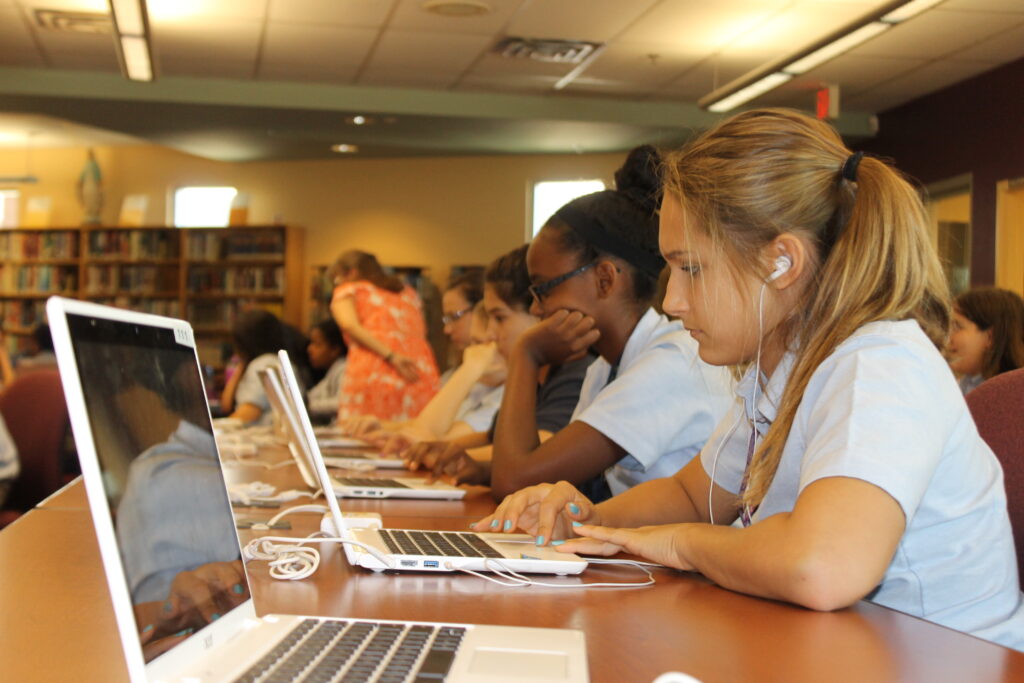 Allison Rutherman, a freshman at Bourgade Catholic High School, along with her classmates, study during tech boot camp. Courtesy of Bryan Burgoz)