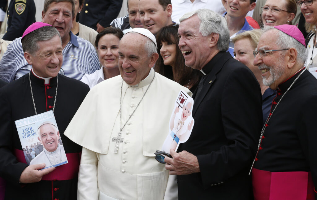 U.S. Archbishop Blase J. Cupich of Chicago, left, and Bishop Gerald F. Kicanas of Tucson, Ariz., right pose with Pope Francis during his general audience in St. Peter's Square at the Vatican Sept. 2. The pope is also flanked by Father Jack Wall, president of Catholic Extension. (CNS photo/Paul Haring)