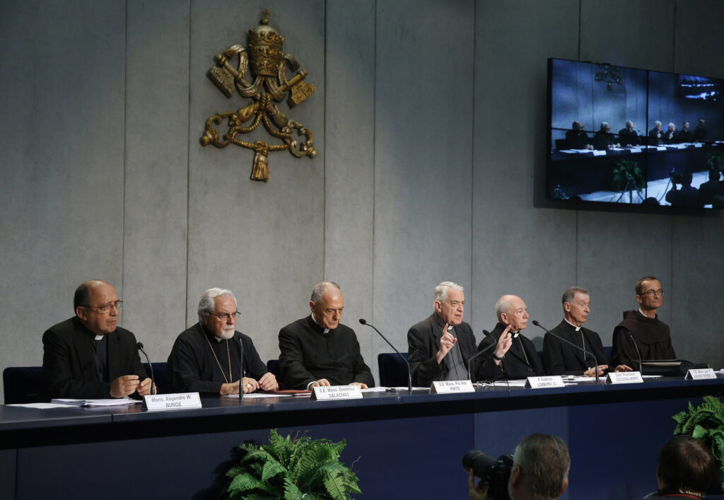 Father Federico Lombardi, the Vatican spokesman, gestures at a press conference for the release of Pope Francis' documents concerning changes to marriage annulments at the Vatican Sept. 8. Pope Francis approved rewriting sections of the Latin-rite Code of Canon Law and the Code of Canons of the Eastern Churches to make the annulment process quicker, less expensive and more pastoral. (CNS photo/Paul Haring)