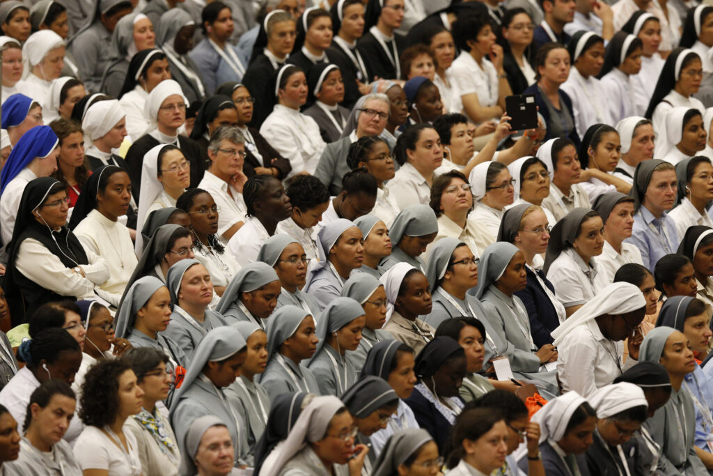 Religious, mainly women, from around the world attend an audience with Pope Francis in Paul VI hall at the Vatican Sept. 17. The pope praised women religious for always heading to the "front lines" to bring the church's tenderness and motherly love to those most in need. (CNS photo/Paul Haring) 