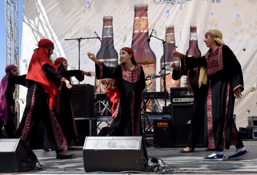 Palestinian students from a Greek Orthodox school perform a traditional dance at the Taybeh Oktoberfest in the West Bank village of Taybeh Sept. 19. (CNS photo/Debbie Hill)