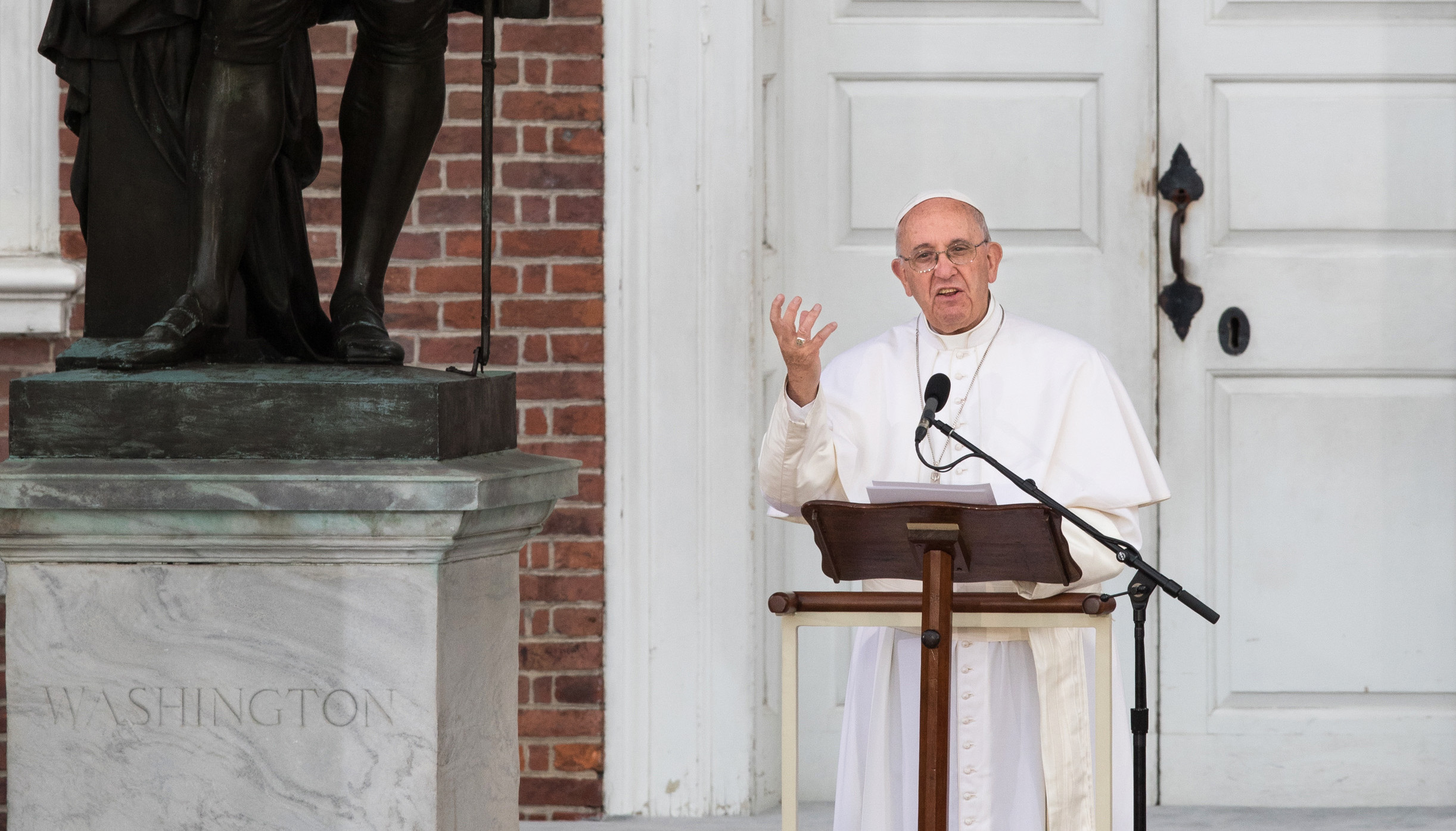Pope Francis delivers an address from Independence Hall in Philadelphia Sept. 26. He spoke near a statue of George Washington to an estimated crowd of 50,000 people. (CNS photo/Lisa Johnston, St. Louis Review)
