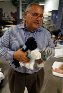 Jerry Castro, dining room manager, has also become an expert in guest hospitality. A network of staff from the Human Services Campus,  volunteers and donors has allowed guests to spend the night indoors on simple mats since April 1 when an overflow shelter for the homeless closed. (Ambria Hammel/CATHOLIC SUN)