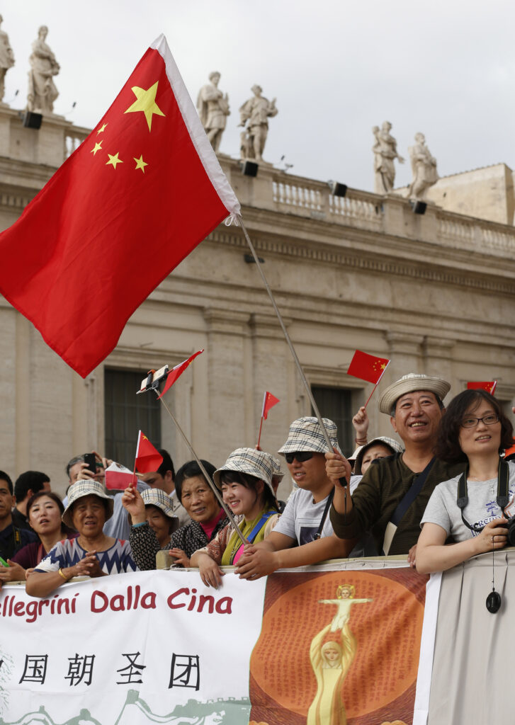 Pilgrims from China cheer as Pope Francis arrives to lead his general audience in St. Peter's Square at the Vatican Sept. 16. (CNS photo/Paul Haring)