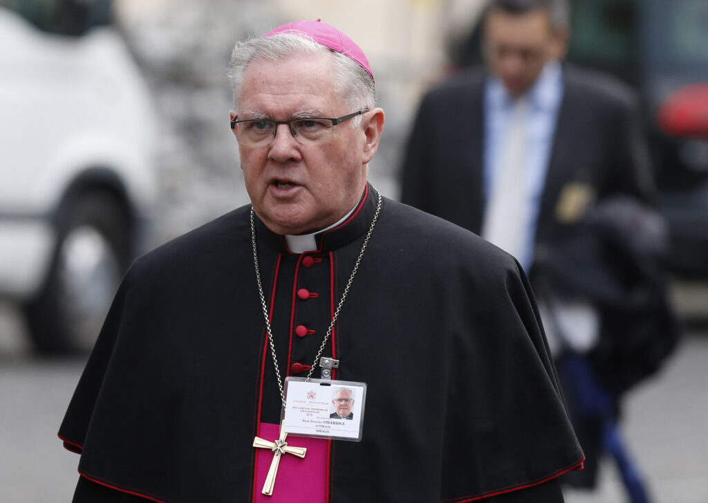 Archbishop Mark Coleridge of Brisbane, Australia, arrives for a session of the Synod of Bishops on the family at the Vatican Oct. 14. (CNS photo/Paul Haring)