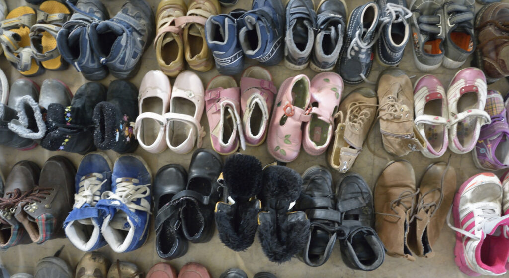 Donated shoes await child refugees near Hegyeshalom, Hungary, Sept. 24. (CNS photo/Paul Jeffrey)