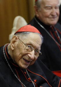 Swiss Cardinal Georges Cottier and Italian Cardinal Andrea Cordero Lanza di Montezemolo, right, attend a conference on "Gaudium et Spes" at the Vatican Nov. 5. Young people at the event received scrolls commemorating the 50th anniversary of "Gaudium et Spes," the pastoral constitution on the church in the modern world. (CNS photo/Paul Haring)