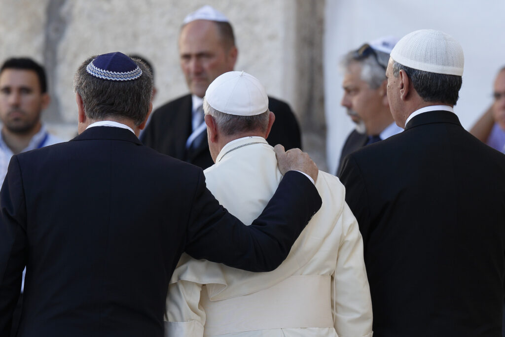 Pope Francis walks with Argentine Rabbi Abraham Skorka, left, and Omar Abboud, a Muslim leader from Argentina, as he leaves after praying at the Western Wall in Jerusalem in this May 26, 2014, file photo. In his official proclamation of the Holy Year of Mercy, Pope Francis called for "fervent dialogue" between Christians, Muslims and Jews. (CNS photo/Paul Haring)