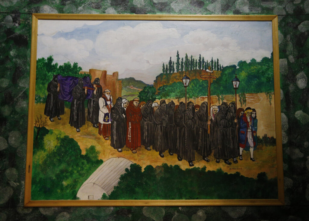 A painting showing members of the Archconfraternity of St. Mary of the Oration participating in a funeral procession is seen at the Church of St. Mary of the Oration and Death in Rome Nov. 18. (CNS photo/Paul Haring)