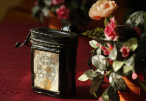 A coin box to collect money to bury the dead is seen at the Church of St. Mary of the Oration and Death, the headquarters of a confraternity with a legacy of burying the dead, in Rome Nov. 18. (CNS photo/Paul Haring)