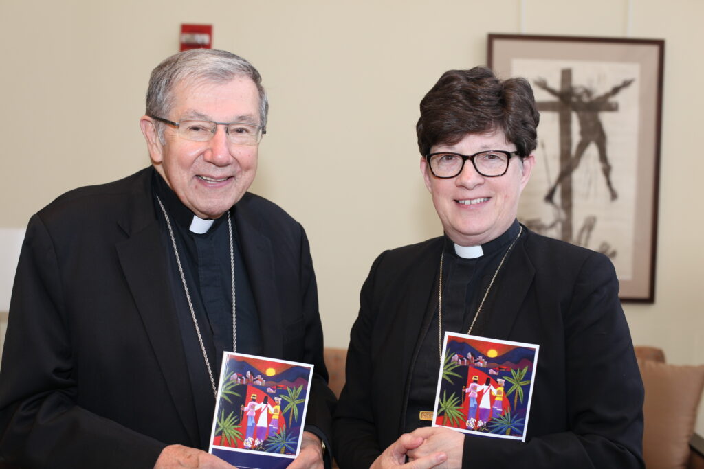 Bishop Denis J. Madden, auxiliary bishop of the Archdiocese of Baltimore (left) and the Rev. Elizabeth A. Eaton, presiding bishop of the Evangelical Lutheran Church of America, hold copies of “Declaration on the Way: Church, Ministry and Eucharist.” The document highlights the journey toward unity between Catholics and Lutherans. (Photo courtesy of ELCA)
