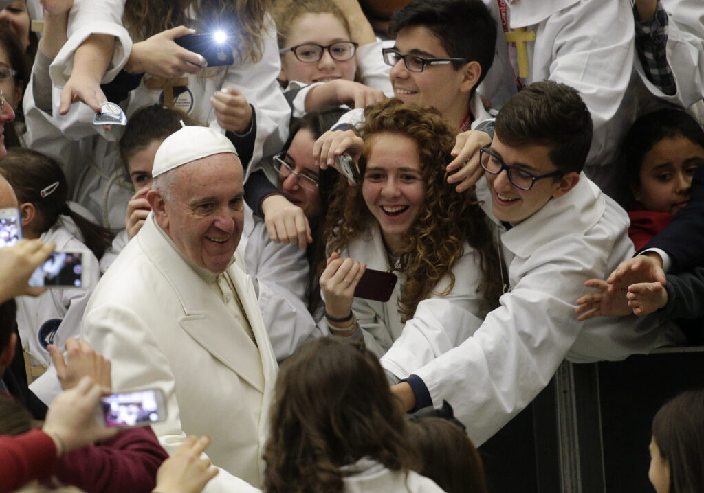 Pope Francis arrives to lead a special audience with the International Congress of Pueri Cantores in Paul VI hall at the Vatican Dec. 31. (CNS photo/Max Rossi, Reuters)