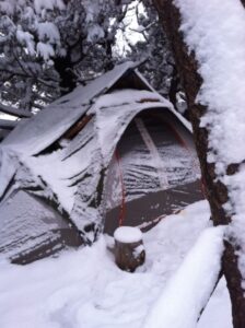 Two individuals remain in this campsite while awaiting housing placement. Catholic Charities Community Services, as part of its regular outreach to the homeless, provided a two-night hotel stay when weather worsened, plus shelter referral. (courtesy photo)