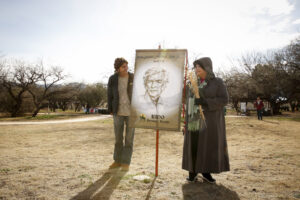 Carmen Dolny (left) and Rosie Garcia display a banner showing an image of Jesuit Father Eusebio Francisco Kino at the Tumacacori National Historical Park in Tumacacori, Ariz., Jan. 10. The women, both admirers of the pioneer missionary, took part in the park's Kino Legacy Day, paying homage to his contributions to the church and people in Pimeria Alta, what is now southern Arizona and northern Sonora, Mexico. (CNS photo/Nancy Wiechec)